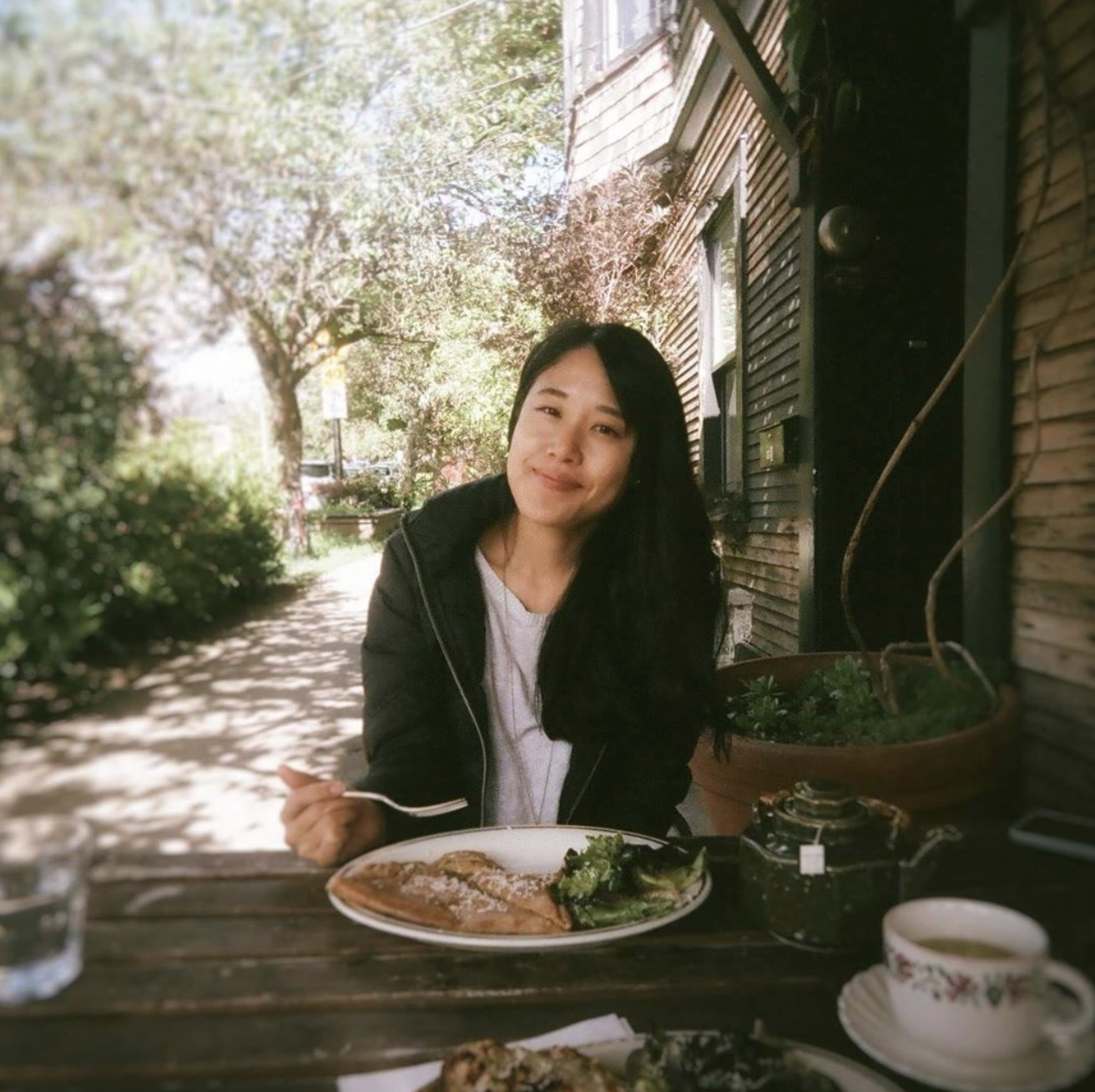 Picture of Julie Abe eating outdoors in the daytime